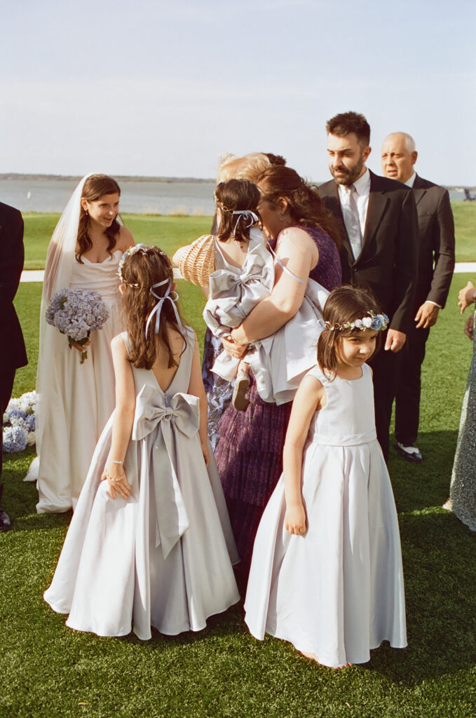 family gathered around a newly wed couple at a wedding at Chesapeake Bay