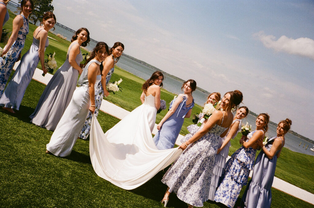 bride and bridesmaids walking away from the camera