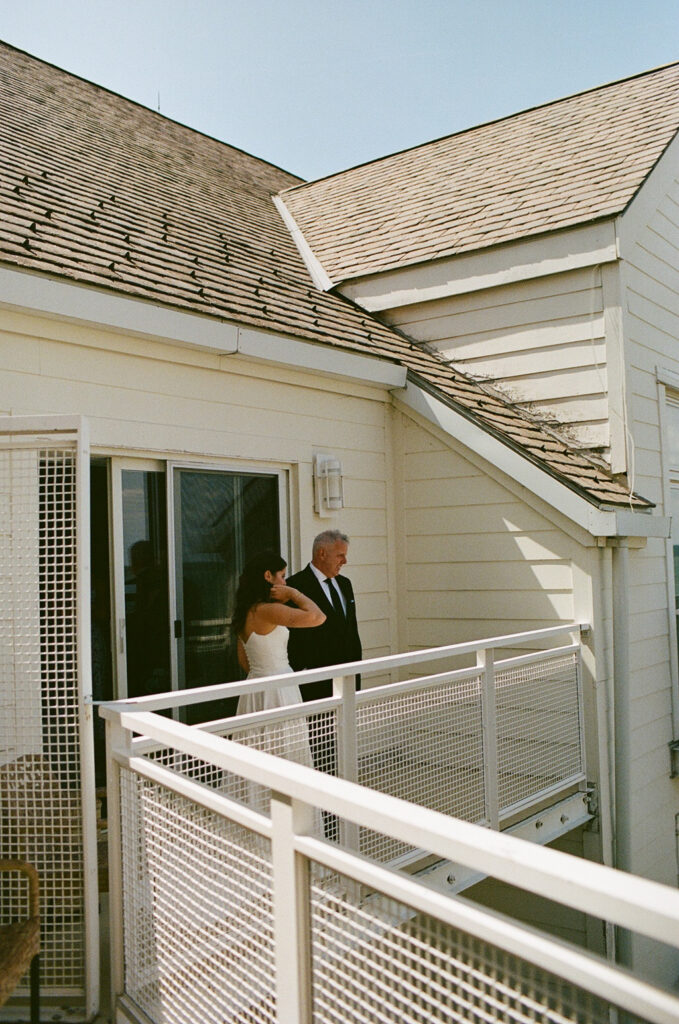 A bride and her father sharing a private moment
